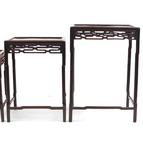 463a - Chinese rosewood quartetto nest of occasional tables, each with pierced carving, the largest 71.5cm ... 