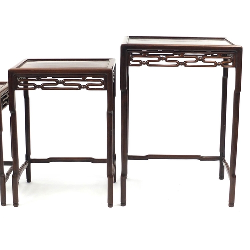 463a - Chinese rosewood quartetto nest of occasional tables, each with pierced carving, the largest 71.5cm ... 