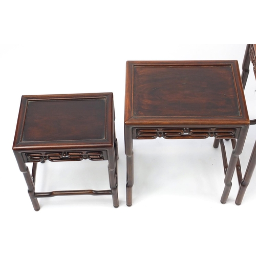 463a - Chinese rosewood quartetto nest of occasional tables, each with pierced carving, the largest 71.5cm ... 