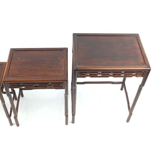 463a - Chinese rosewood quartetto nest of occasional tables, each with pierced carving, the largest 71.5cm ... 