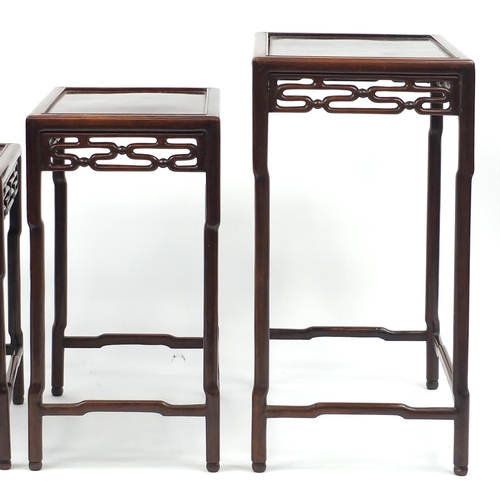 463a - Chinese rosewood quartetto nest of occasional tables, each with pierced carving, the largest 71.5cm ... 