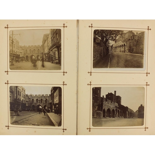 167 - Victorian social history black and white photographs arranged an album including street scenes, cath... 