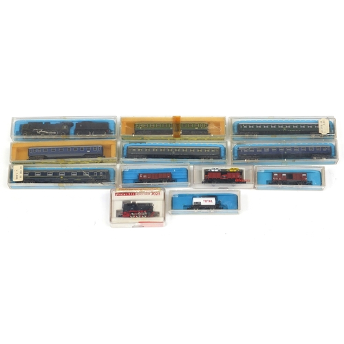 394 - Fleischmann N gauge model railway and accessories including tenders, advertising wagons and track