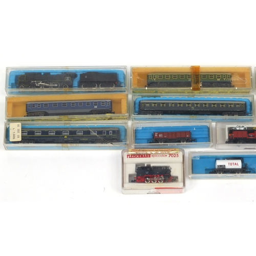 394 - Fleischmann N gauge model railway and accessories including tenders, advertising wagons and track