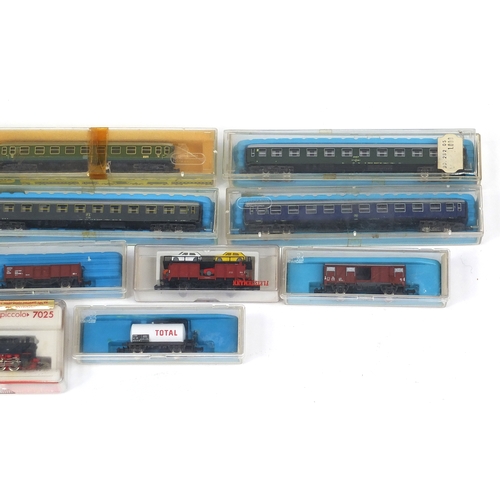 394 - Fleischmann N gauge model railway and accessories including tenders, advertising wagons and track