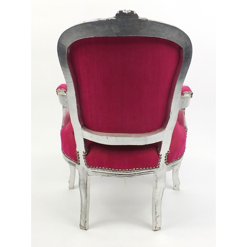 18 - French style open arm chair with silvered frame and pink upholstery, 93cm high