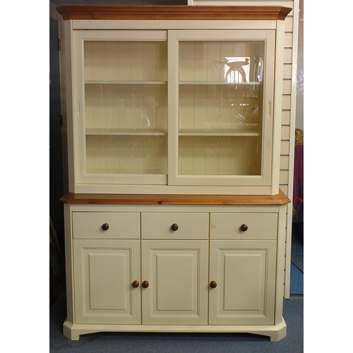 13 - Half painted pine dresser fitted with a pair of sliding glass doors enclosing two shelves above thre... 