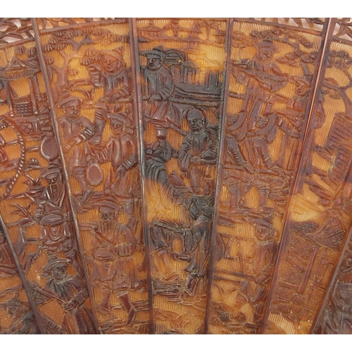 518 - Chinese canton Tortoiseshell fan, finely carved with figures amongst pagodas and dragons, 19cm in le... 