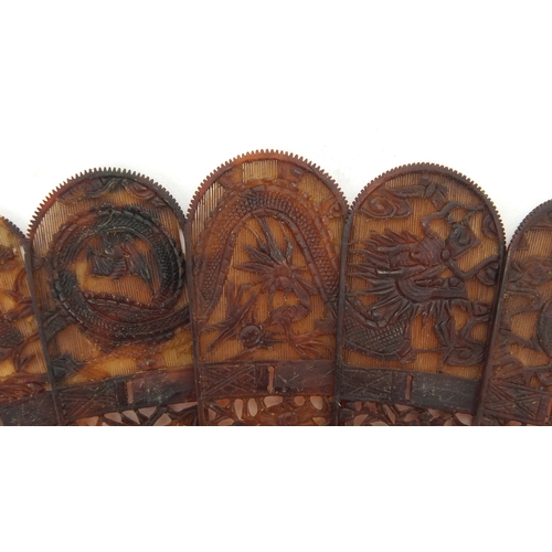 518 - Chinese canton Tortoiseshell fan, finely carved with figures amongst pagodas and dragons, 19cm in le... 