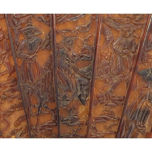 518 - Chinese canton Tortoiseshell fan, finely carved with figures amongst pagodas and dragons, 19cm in le... 