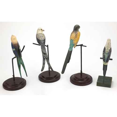 148 - Four painted birds seated on a branch formerly of India Jane on wooden bases, the largest 32cm high