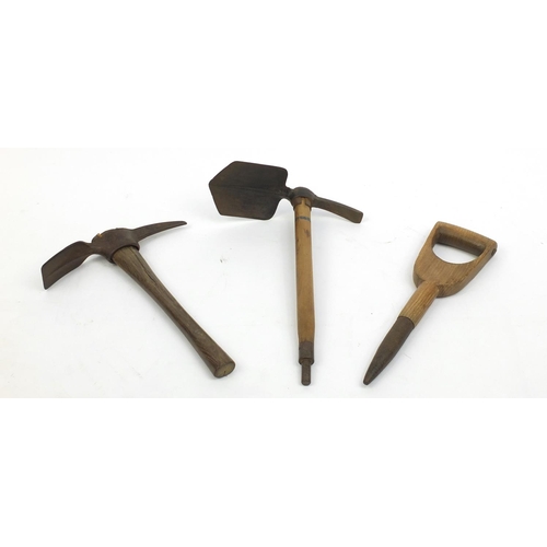 702 - Two vintage pick axes and a spike with wooden hadles