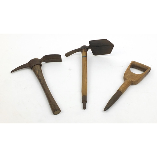 702 - Two vintage pick axes and a spike with wooden hadles