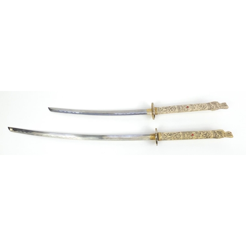 137 - Two decorative Japanese Samurai swords, the largest 105cm in length