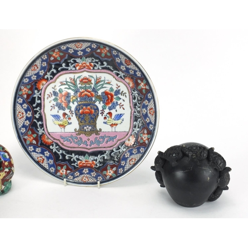 402 - Oriental items including a soapstone carving and a green glazed brush washer, the largest 27cm wide