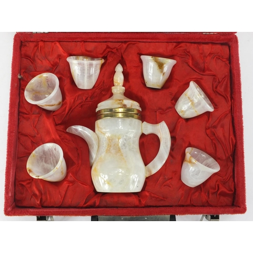 169 - Eastern onyx coffee set with fitted case, the coffee pot 19cm high