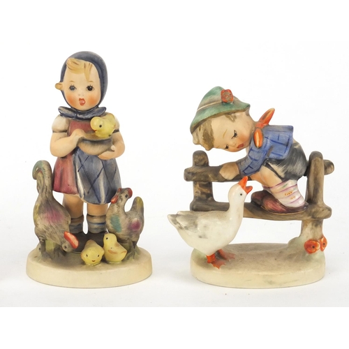 398 - Four hand painted Goebel Hummel figures, the largest 11.5cm high