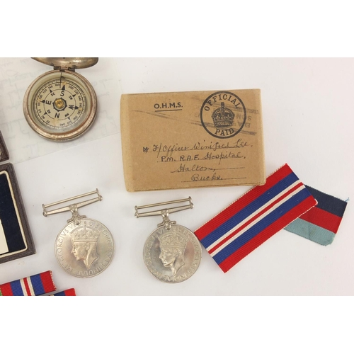 696 - British Military interest World War II medals with paperwork, a compass and two Masonic medals