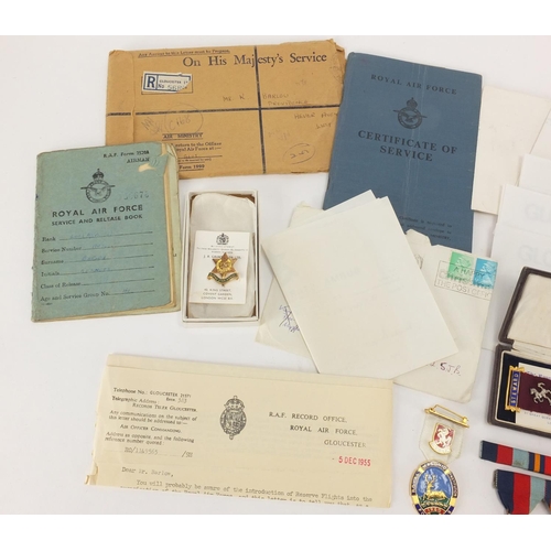 696 - British Military interest World War II medals with paperwork, a compass and two Masonic medals