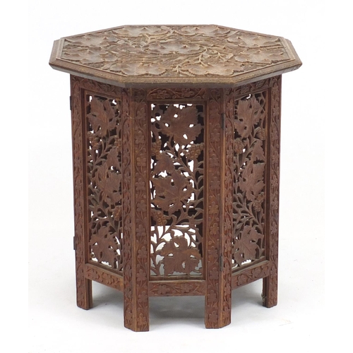 63 - Middle Eastern profusely carved folding occasional table