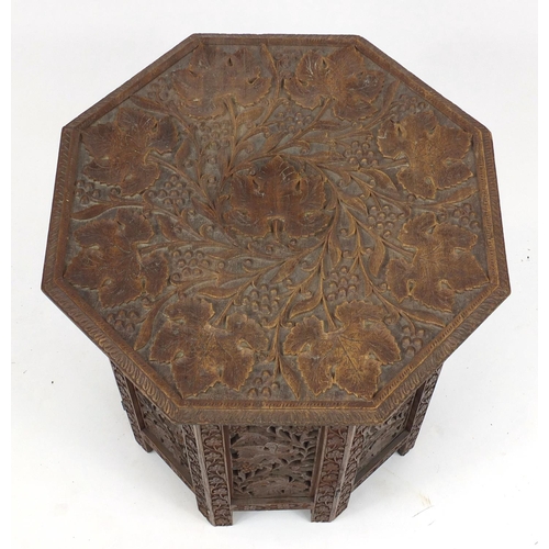 63 - Middle Eastern profusely carved folding occasional table