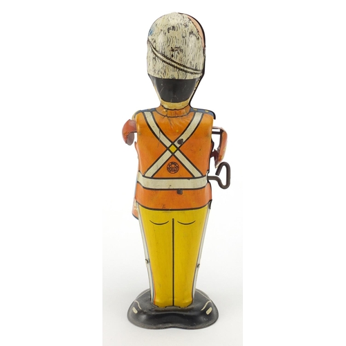 409 - Marx tin plate clockwork drummer soldier, 23cm high