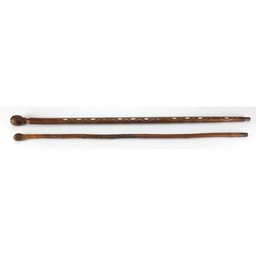 425 - Hardwood walking cane, possibly from the Pacific Islands with Mother of Pearl and silver coloured me... 