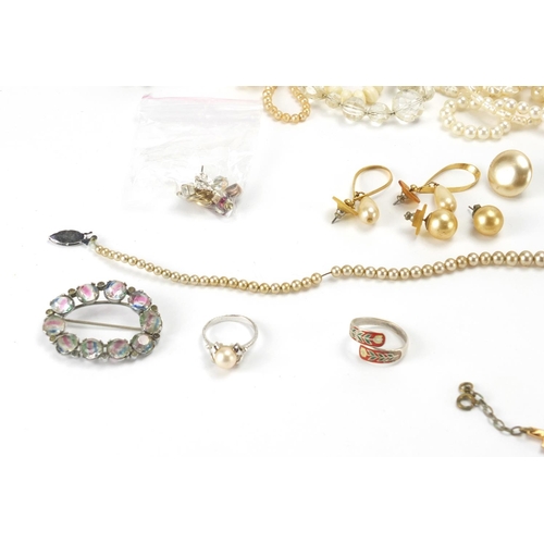 309 - Costume jewellery including simulated pearl necklaces and silver items