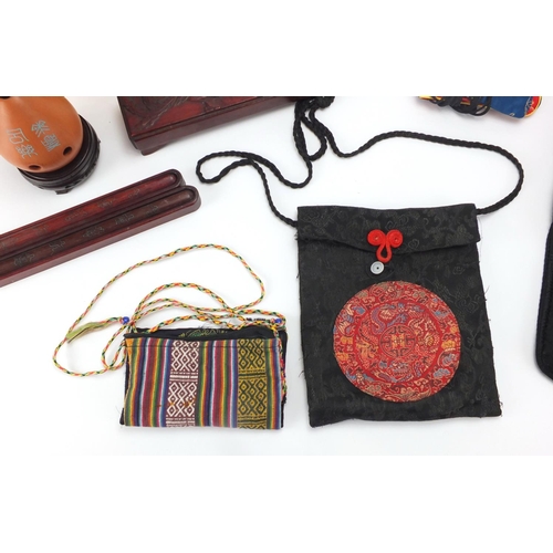 571 - Oriental objects including embroidered bags, chopsticks with metal inlay and a terracotta pot pourri