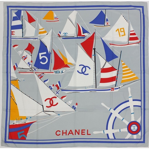 2051 - Chanel silk scarf with box having a boat race design, 130cm x 130cm