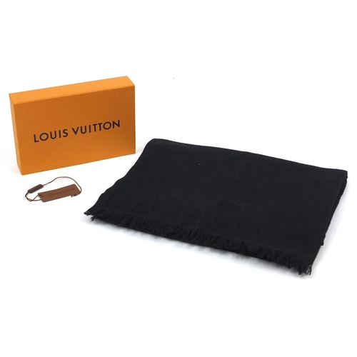 2048 - Louis Vuitton silk and wool scarf with box having an all over monogram design, 190cm x 68cm