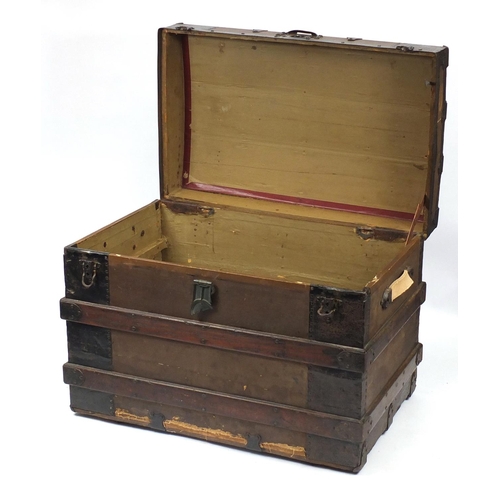 2031 - Vintage dome topped wooden bound travelling trunk with carrying handles, 57cm H x 77cm W x 48cm D