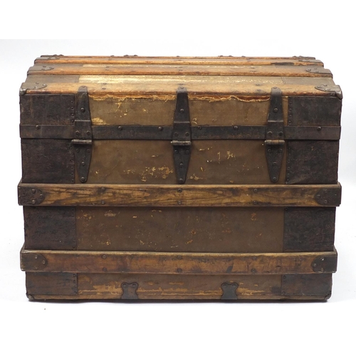2031 - Vintage dome topped wooden bound travelling trunk with carrying handles, 57cm H x 77cm W x 48cm D