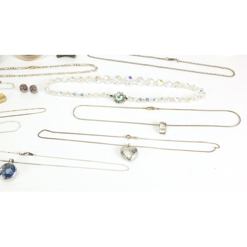 2461 - Mostly silver jewellery including necklaces, pendants, and a 9ct white gold diamond ring