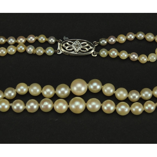 2458 - Two row pearl necklace with 9ct white gold diamond clasp, 40cm in length, approximate weight 25.3g