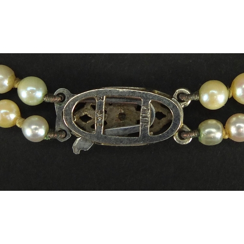 2458 - Two row pearl necklace with 9ct white gold diamond clasp, 40cm in length, approximate weight 25.3g