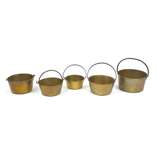 2060 - Five brass preserve pans with iron handles, the largest 37cm high