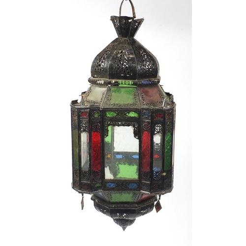 2055 - Pair of Moroccan metal light hangings with coloured glass panels, each 85cm high