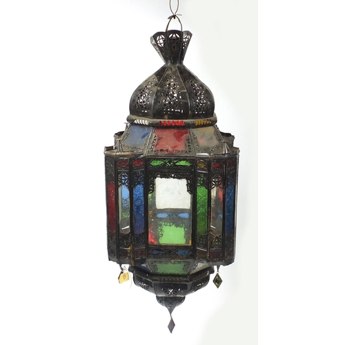 2055 - Pair of Moroccan metal light hangings with coloured glass panels, each 85cm high