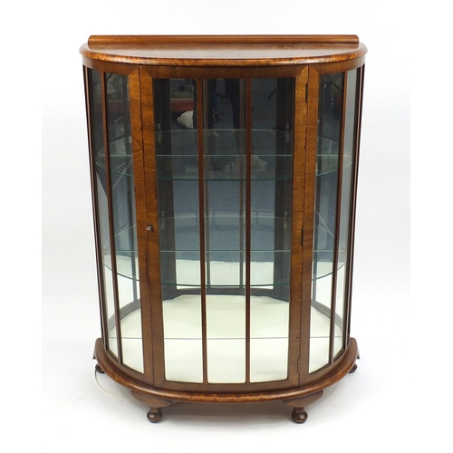 2008 - 1920's walnut bow fronted china cabinet with mirrored back and two glass shelves, 119cm H x 87cm W x... 