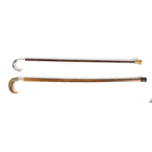 177 - Two wooden walking canes one with silver handle, the other with silver collar and horn handle