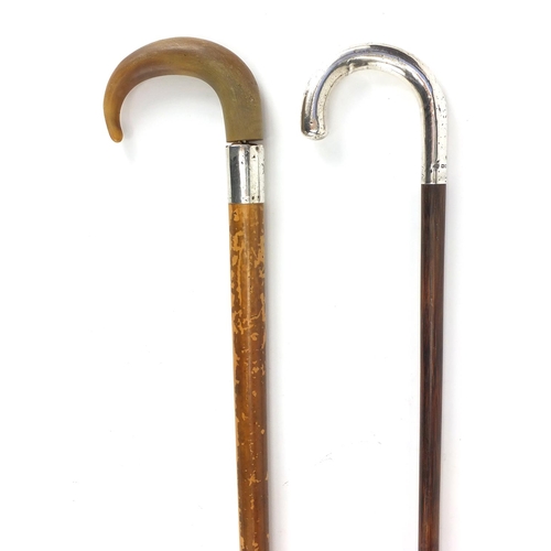 177 - Two wooden walking canes one with silver handle, the other with silver collar and horn handle