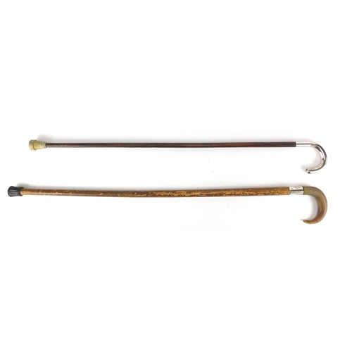 177 - Two wooden walking canes one with silver handle, the other with silver collar and horn handle