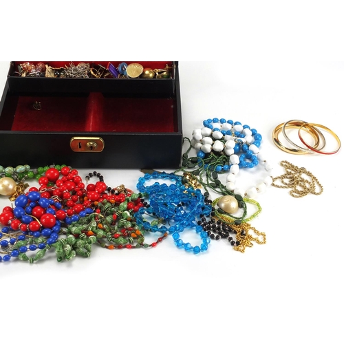 294 - Mostly vintage costume jewellery including earrings, necklaces and bracelets, housed in a jewellery ... 