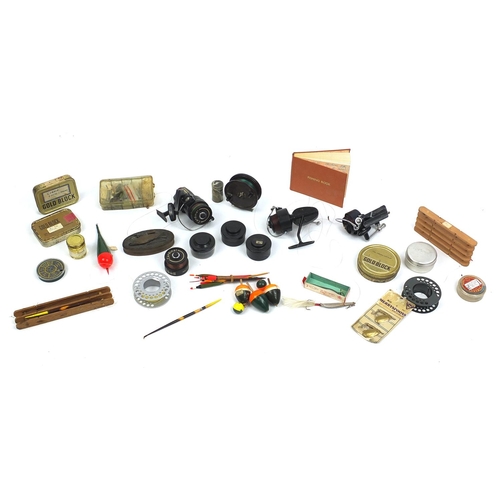 565 - Vintage fishing tackle including floats, lures and reels