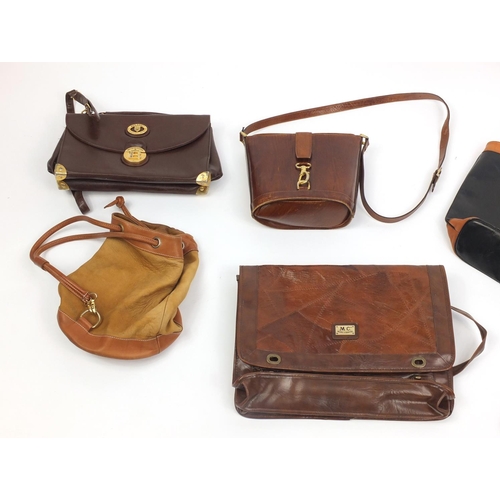 486 - Group of mostly leather and designer ladies handbags