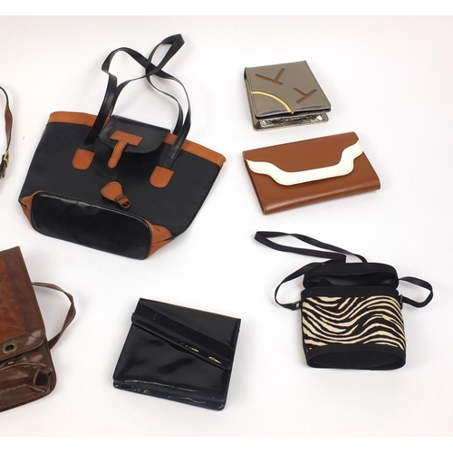 486 - Group of mostly leather and designer ladies handbags