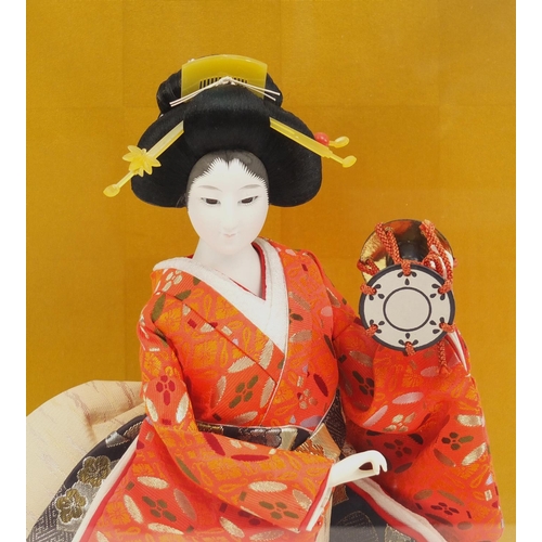 118 - Geisha girl figurine in a display case, 54cm high