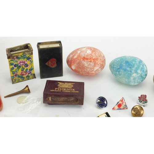 388 - Bag of objects including polished stone eggs, enamelled badges and matchbox cases