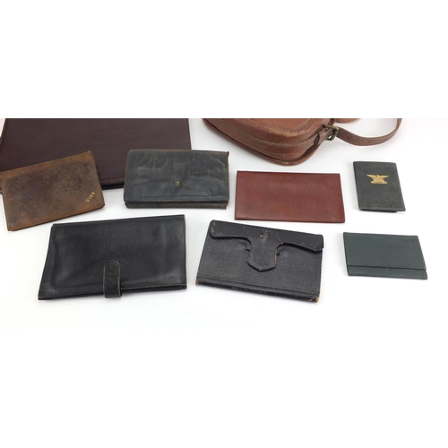 710 - Vintage leather holdall and a group of leather wallets